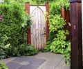 The couple saved this old church door for years before they found the perfect place for it. They had the gate built to match and added the hardware.