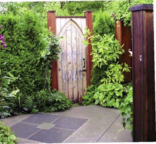 The couple saved this old church door for years before they found the perfect place for it. They had the gate built to match and added the hardware.