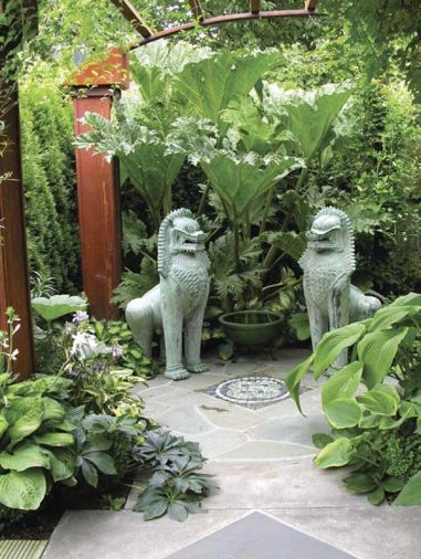 Artist Rick Zook was commissioned to create a black and turquoise pebble mosaic, to play off the patina of the bronze Thai Temple Lions, a find from a local estate sale.