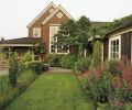 Using an easy-care palette of plants selected for texture, Michael was also able to direct guest traffic around the exterior spaces, linking decks, porches, and arbors to lure visitors from one area to another.