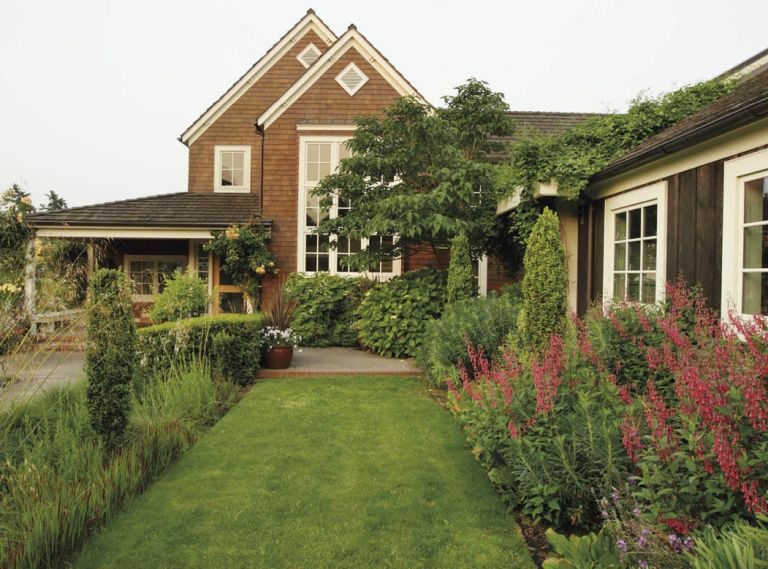 Using an easy-care palette of plants selected for texture, Michael was also able to direct guest traffic around the exterior spaces, linking decks, porches, and arbors to lure visitors from one area to another.
