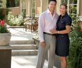 Tom and Lisa Brenneke stand alongside the back of their entirely remodeled 1909 Italian villa on a beautiful summer’s day. Adjustable Lutron lighting systems set the scene at night.