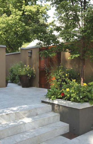 The barbeque is kept handily from view behind painted levered doors built into the courtyard wall.