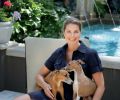 Lisa sits at right with her beloved Italian greyhounds at the foot of the pool. “I love the sound of the water spilling from the Cannons,” says Lisa, of the hot water that tumbles into the 4.5’ deep pool all summer long.