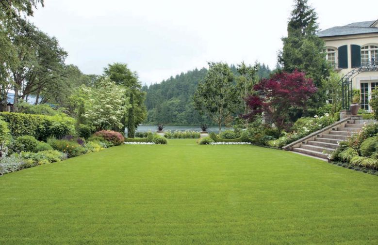 When landscape architect Larry Cavender began work on this garden, he had two main charges: create a handsome entry from the front of the house and its motor court into the lower garden, and restore the compacted soil to something that would actually grow a plant. All of this has been accomplished, plus framing Lake Oswego views with inventive plantings and paving.
