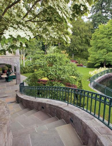 Cavender used bluestone paving throughout the Geary garden, which unifies the surfaces of the existing serpentine stairway and the loggia. All of the new ironwork in the garden is created by the same company, Dyadic Ironworks, inspired to match the railings and balconies on the house, increasing the unbroken continuity.