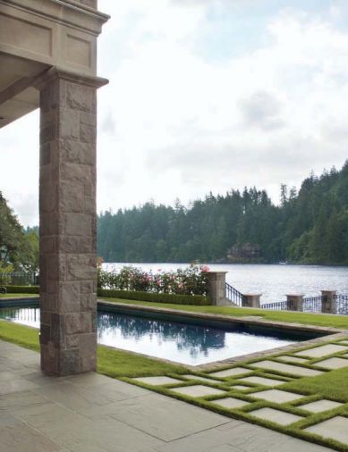 When the bluestone near the pool is wet, it is the same color as the lake on a cloudy day. Pavers outlined and separated by sod can be mowed easily, and reduce wear and tear on high traffic areas.