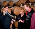 At Agate Ridge Winery owner Kim Kinderman and vineyard manager Jon Meadors get a barrel sample from winemaker Brian Denner.