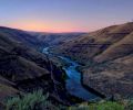 The rugged beauty of lower Deschutes River looking north across the Columbia River toward the distant windmills in Goldendale, Washington.