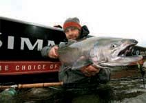 Eric Neufield with a beautiful Chinook salmon, which occasionally take steelhead flies.