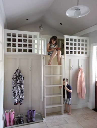 The loft features a ladder that invites children of all ages to lounge on a plush carpet remnant, pluck good reading from book shelves and bask in the light from an upper window.