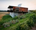 The uniquely designed tasting room at Amavi Cellars offers romantic views of the estate vineyards.