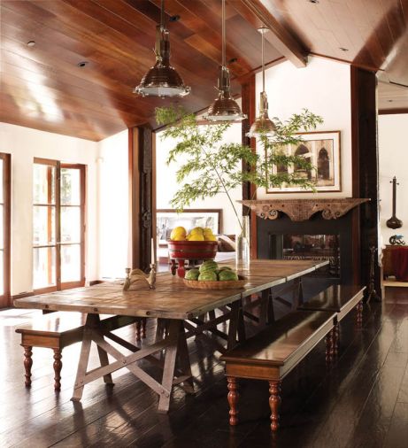 Designed by Martyn Lawrence Bullard, rock star Kid Rock’s Malibu retreat’s dining hall features a photo of Cuba by Michael Eastman. The dining room table from Dos Gallos was made from an antique French wine cellar floor. The nickel hanging fixtures are from Urban Archaeology.