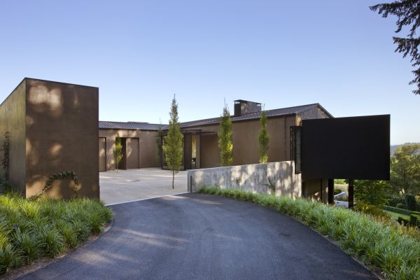 Perched on a hill overlooking Portland, the home and landscaping were designed to take advantage of views and follow the hillside’s natural contours.