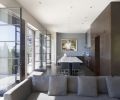 The family room and kitchen were designed to be an open and relaxed space at the weight end of the home’s dumbbell-like design. The kitchen was arranged to provide separate areas for cooking and cleanup to accommodate the homeowners working side by side. French doors stretch across the combined space and open on to a south facing deck.