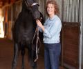 Marilyn Essex shows off Phoenix, the thoroughbred she rescued who now lives in the property’s six-stall barn.