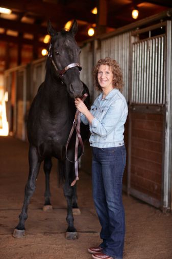 Marilyn Essex shows off Phoenix, the thoroughbred she rescued who now lives in the property’s six-stall barn.