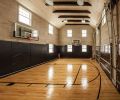 The basketball court that doubles as a three car garage was Rob s idea.