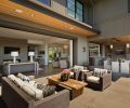 Another outdoor conversation space is located off the interior living area, featuring Biscayne sofa and chairs by Restoration Hardware, with a Larkspur coffee table.