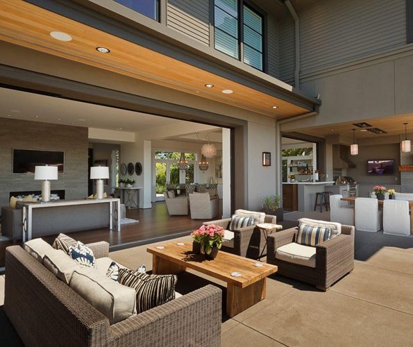Another outdoor conversation space is located off the interior living area, featuring Biscayne sofa and chairs by Restoration Hardware, with a Larkspur coffee table.