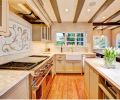 Seattle contractor Ryan McKinney of McKinney Group, Inc. stretches his design wings and builds his clients a rustic, comfortable and functional kitchen that honors the home’s architecture while providing a family hub. Given a magazine photograph of a mosaic, McKinney tracked down a source and then reformatted the design to fit the space above the stove.