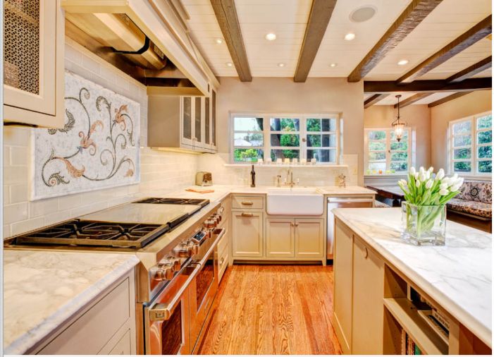 Seattle contractor Ryan McKinney of McKinney Group, Inc. stretches his design wings and builds his clients a rustic, comfortable and functional kitchen that honors the home’s architecture while providing a family hub. Given a magazine photograph of a mosaic, McKinney tracked down a source and then reformatted the design to fit the space above the stove.