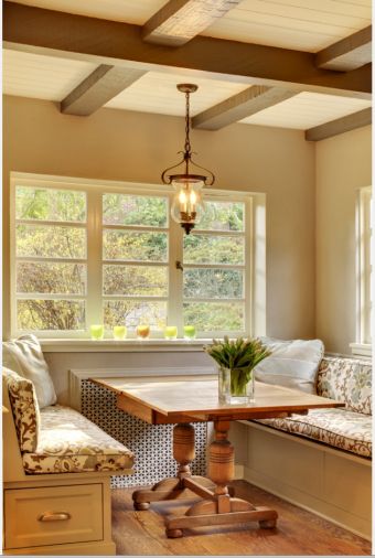 Demolition took the old kitchen down to the wall studs and subflooring. Now all that remains is the original footprint and windows. The custom-built bench seating echoes the cabinetry style used elsewhere in the room and also provides storage space in deep drawers. A pendant light and the purchased-for-the- space rustic table mix old with new and reinforces the home’s traditional design. White oak floors, used in adjoining rooms, were brought into the kitchen for continuity.