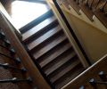 Stairs connecting the first and second floors have Appalachian oak treads and tiled risers. The balusters and railing were treated to the same espresso stain used in the den.