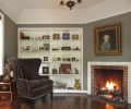 The family room addition incorporated Brookman’s characteristic cast cement fireplace mantel, and tray ceiling.