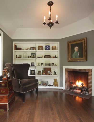 The family room addition incorporated Brookman’s characteristic cast cement fireplace mantel, and tray ceiling.