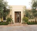 Joelle Nesen of Maison, Inc. transformed this 1997 So Cal estate built by home designers Bob and Jeff Holcombe for her long term Pacific Northwest clients. Her challenge was to marry their individual tastes into one harmonious vision for Southern California living. A pair of lofting olive trees embrace the entrance, where oversized antique Spanish wooden doors, guarded by a pair of antique bronze Cambodian Foo Dogs, purchased when the couple were married in Cambodia, open up a whole new world for the Northwest couple.