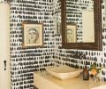 Schumacher s Queen of Spain wallcovering adds graphic glory to the powder room, with Alpha Stoneworks counter and Gearhart Ironwerks stand.