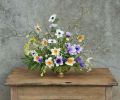 Use this flower guide: 8 Stems Daffodil Narcissus ‘Barrett Browning,’ 13 Stems Anemone Anemone coronaria ‘Carmel White’ & Pastel Mix, 5 Stems Dwarf Sweetbox Sarcococca hookeriana humilis, 5 Stems Winterhazel Corylopsis pauciflora, 5 Stems Flowering Plum Prunus cerasifera, 3 Stems Spirea Spiraea thunbergii 2 Stems Corsican hellebore Helleborus argutifolius.