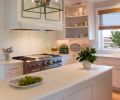 Inside and out, this kitchen in Portland’s Forest Heights neighborhood is all about natural beauty. Painted in pale greys and white, the hardwood shelves, cabinets and drawers showcase the owners’ ironstone and glassware collection, accentuated by polished nickel lights from Circa Lighting.