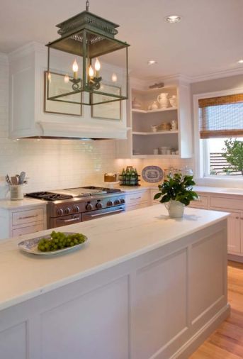 Inside and out, this kitchen in Portland’s Forest Heights neighborhood is all about natural beauty. Painted in pale greys and white, the hardwood shelves, cabinets and drawers showcase the owners’ ironstone and glassware collection, accentuated by polished nickel lights from Circa Lighting.