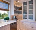 Drawer and cabinet pulls from Restoration Hardware add a homey touch of elegance. Easy to clean subway tiles accommodate practical, everyday use of the quartz countertop, fabricated and installed by Milan Stoneworks.