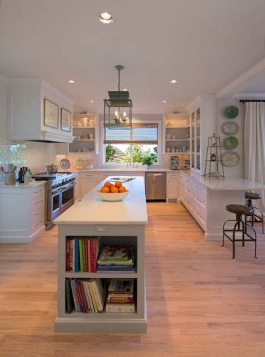 The floors in this kitchen got a facelift too. The original 1980s-era honey finish was stripped off to reveal a near-white oak. Semler refinished the wood in a white matte finish from England -- Pallman Magic Oil 2K, an oil/wax hybrid. Now this central hub of the house can stand up to continuous foot traffic with just a quick mop cleaning.