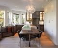 In this Portland kitchen designed by Barbara Sumner, the island’s horizontal bookmatched solid Western walnut from Crosscut Hardwood was used to ground the outer perimeter of the room. Sumner used walnut, quartz and stainless to unify the 16-foot-long island and seating area. Stainless steel legs were manufactured by Hanset Stainless, which also clad the cabinetry.