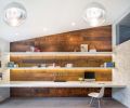 A new home office was created from a garden storage area and seamlessly adopted into the home’s architectural design. Capitalizing on the rest of the structure’s mid-century elements, the space features streamlined shelving with integrated lighting, a PentalQuartz desktop and locally sourced barn wood that has found a second life as wall paneling.