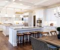 The floor plan of this Vancouver, Washington kitchen designed by Andy Morr of Hayes Cabinets is thoughtful, creating spaces where you know exactly what you’re supposed to do. The abundance of white takes advantage of the natural light but is offset with the sheen of the grey marble and the warmth of the rustic wood tones.