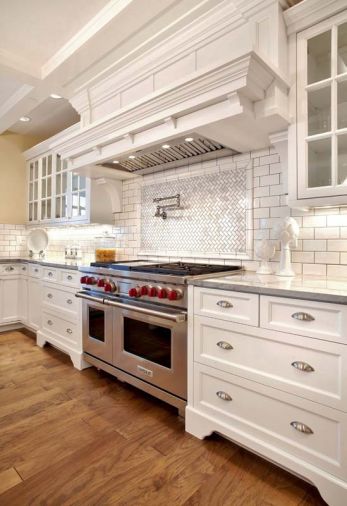 Keeping with the classic feel the homeowners wanted, gleaming white subway tile was selected for the backsplashes.