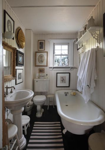 A collection of objets d’art, family artwork and photos invites one to loll a while in the original clawfoot tub in the downstairs bath. An antique turtle shell, likely harvested for its protective plates, hangs above Diane’s painting of their late dog Lucy. Her mother’s wedding picture and maternal grandmother’s watercolor add to the collection.