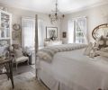 Relaxing shades of white, off-white and soft grays make the master bedroom a soothing retreat. The antique sea grass table reiterates the painted warm gray fir floors. V-groove walls and ceilings are original, and repainted. Bedding is from Sesame + Lilies.