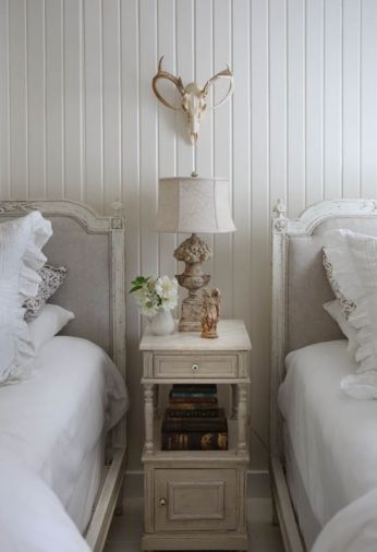 “I love anything French,” says Diane of her reproduction French twin beds dressed with pleated, ruffled duvet and shams. Throw pillows by Les Indiennes are hand-dyed with vegetable dyes and block printed. A French bedside table sports original paint; antique books and an antique plaster angel shine beneath an Aidan Grey lamp. All items can be found at Sesame + Lilies.
