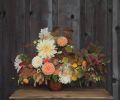 You can assemble this autumnal arrangement designed by Kailla Platt yourself by using these plants and stem count: 6 Dahlia ‘Cafe au Lait,’ 2 Dahlia ‘Crichton Honey,’ 5 Zinnia ‘Persian Carpet,’ 3 Cockscomb Celosia, 3 Northern Sea Oats, 3 Dahlia ‘Ginger Willo,’ 2 Fothergilla foliage, 2 Euonymus europaeus, 3 Heptacodium, 3 Blueberry foliage, 5 Scented Germanium foliage, 2 Viburnum plicatum.