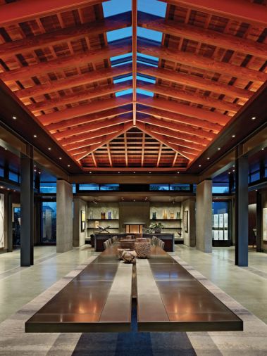 Steel, glass and fir beams catch the evening light. “The roof falls down on all sides of the Pavilion,” says Olson, “creating a womb-like protection, making you feel enclosed although you are open to the outdoors on all sides.”