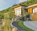 The exterior of this LEED-Platinum Certified custom home is primarily sanded concrete, which creates a uniform, finely textured finish. Sanded concrete is also used throughout the landscaping, including stairs and landings. Cedar wood cladding adds warmth as well as a direct connection to the home’s surroundings. These planks were milled from trees grown within 50 miles in sustainably managed forests.