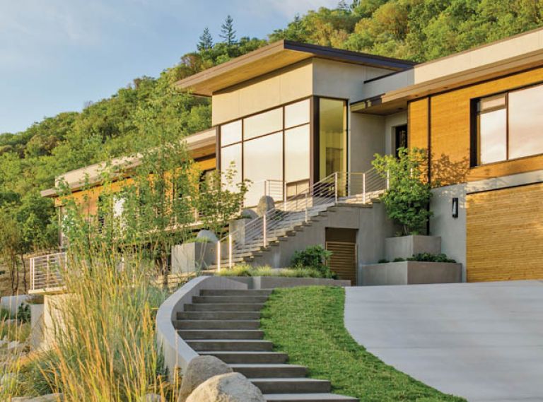 The exterior of this LEED-Platinum Certified custom home is primarily sanded concrete, which creates a uniform, finely textured finish. Sanded concrete is also used throughout the landscaping, including stairs and landings. Cedar wood cladding adds warmth as well as a direct connection to the home’s surroundings. These planks were milled from trees grown within 50 miles in sustainably managed forests.