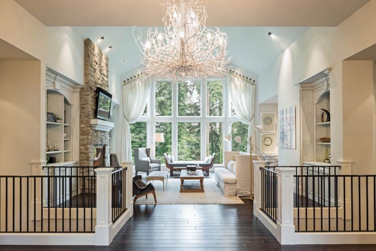 The living room underwent a similar transformation and repeated many of the same elements. In both rooms it was important to the homeowners to allow in as much natural light as possible and to use the view of the outside forest as a focal point.