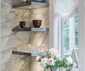 New floating shelves of zinc are equipped with LED lights and provide a display area.